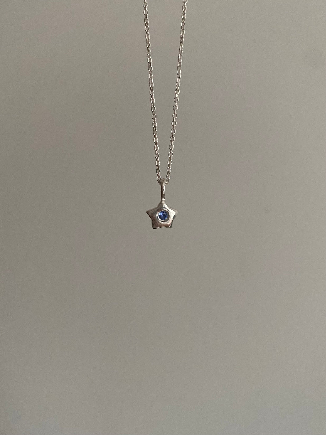 miniature blue star necklace